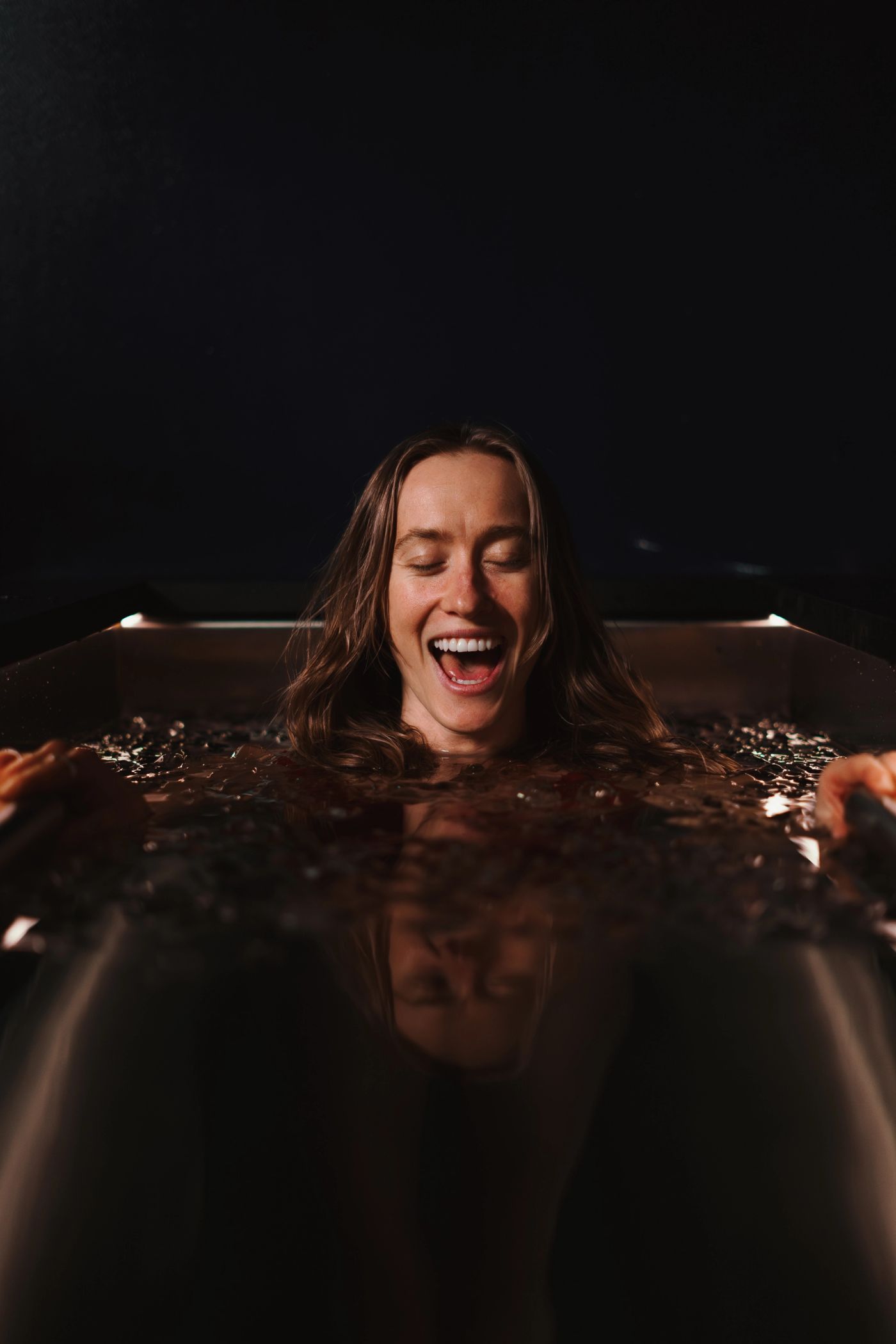A guest in an ice bath at Arc, Canary Wharf