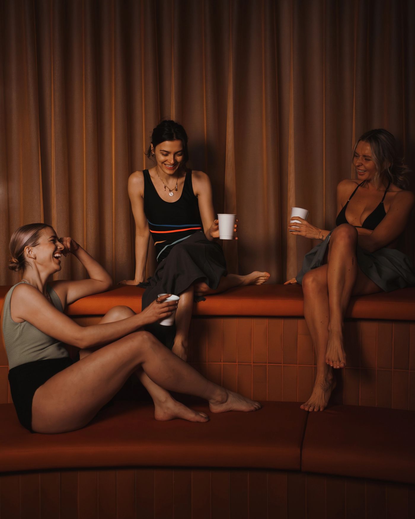 Guests with drinks in the lounge at Arc, Canary Wharf